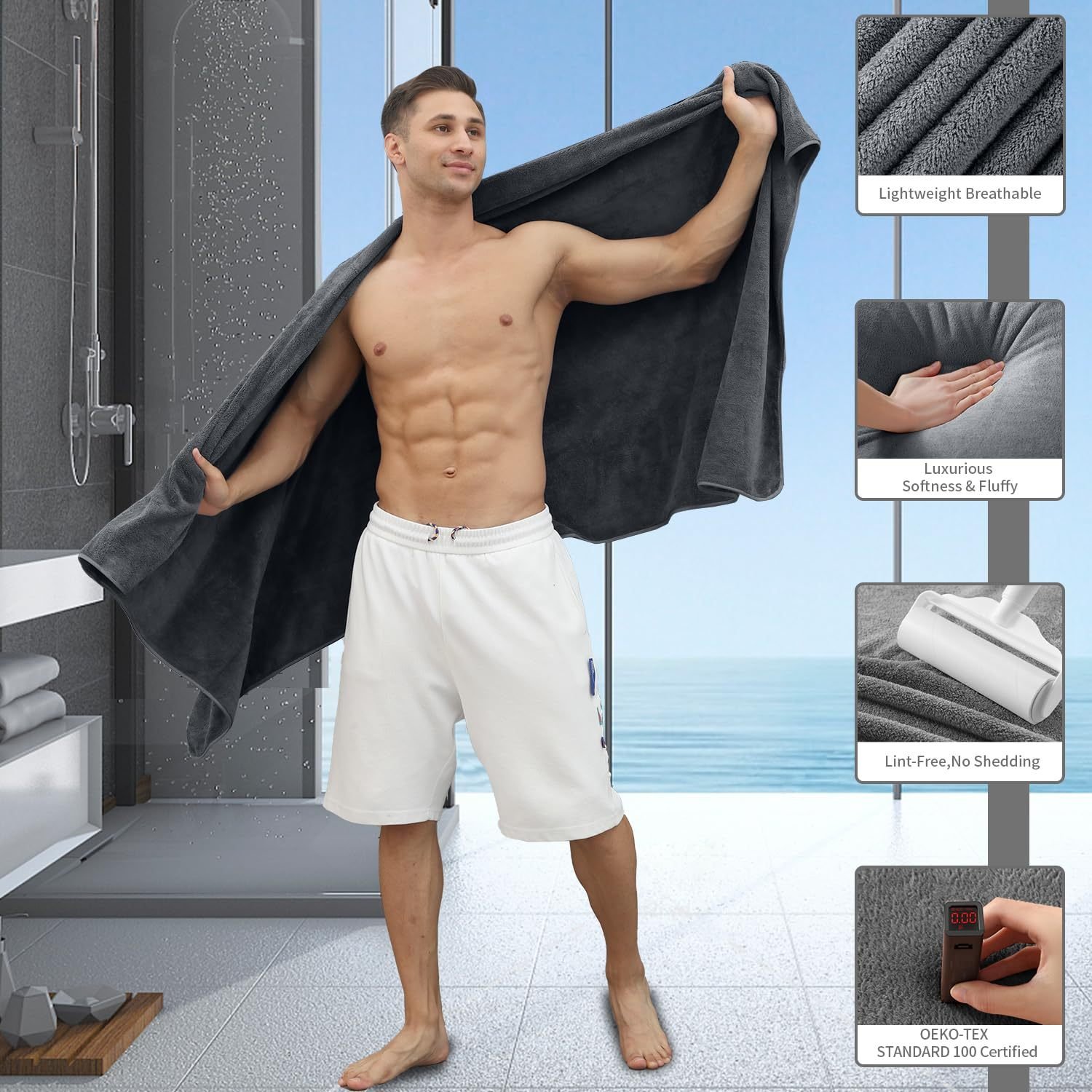 Man holding a large grey coral fleece bath towel in a bathroom