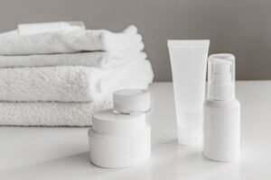 Skincare containers with folded towels