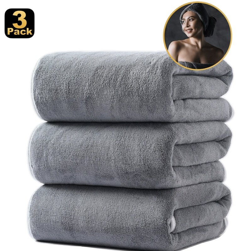 Stack of three grey coral fleece bath towels from a pack of 3
