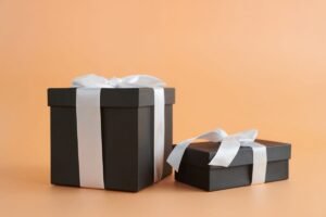 Black gift boxes with white ribbons